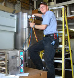 Twin City Service technician repairing commercial refrigeration equipment