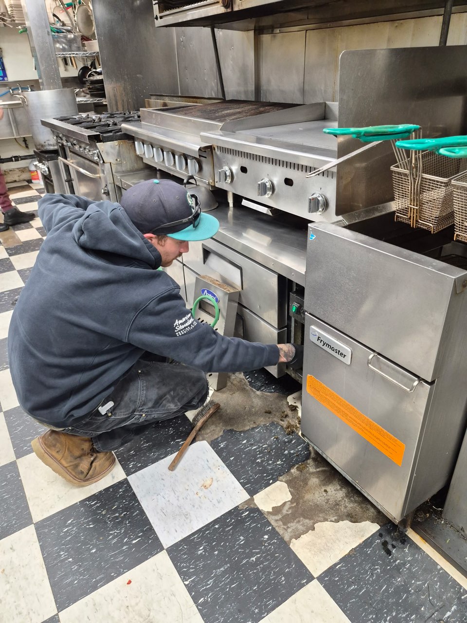 Twin City Service technician installing commercial kitchen refrigeration equipment